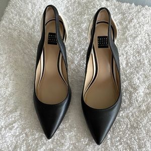 Black/white leather pumps